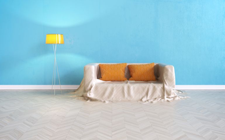 Sofa rising from floor infront of wall