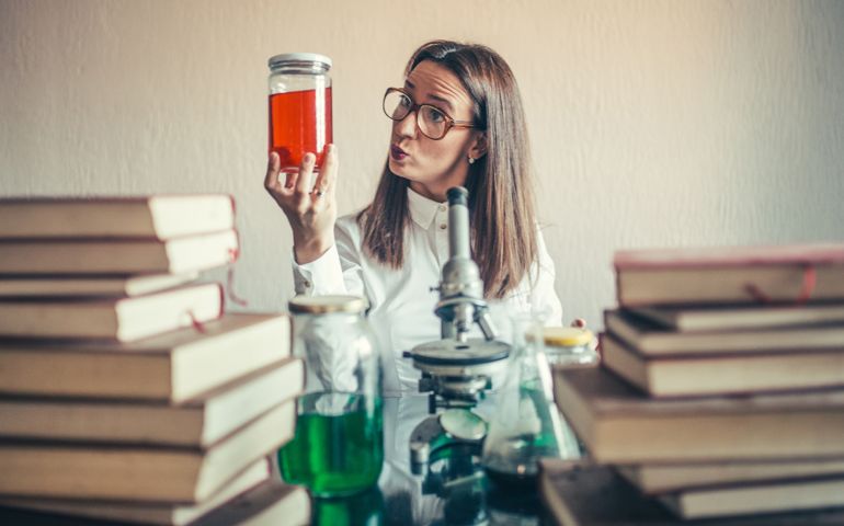Crazy woman chemist in lab.
