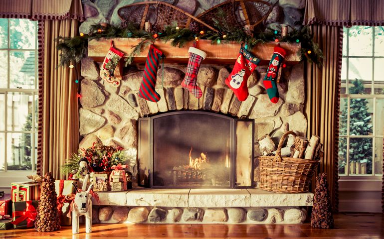 Stone fireplace decorated for Christmas