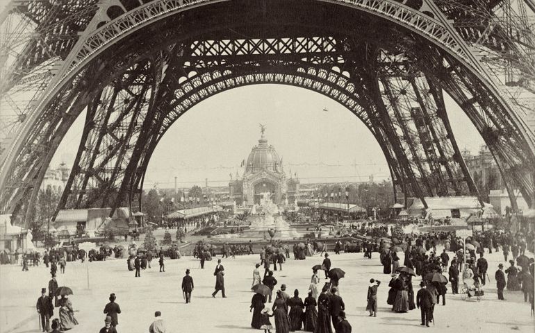 Beneath the Eiffel Tower, Paris, 1889. Designed by the French civil engineer Gustave Eiffel (1832-1923), the Eiffel Tower was built for the International Exhibition staged in Paris in 1889 to commemorate the centenary of the French Revolution. Constructed from iron, it was the tallest building in the world until 1930. From L'Album de l'Exposition 1889 by Glucq, (Paris 1889).