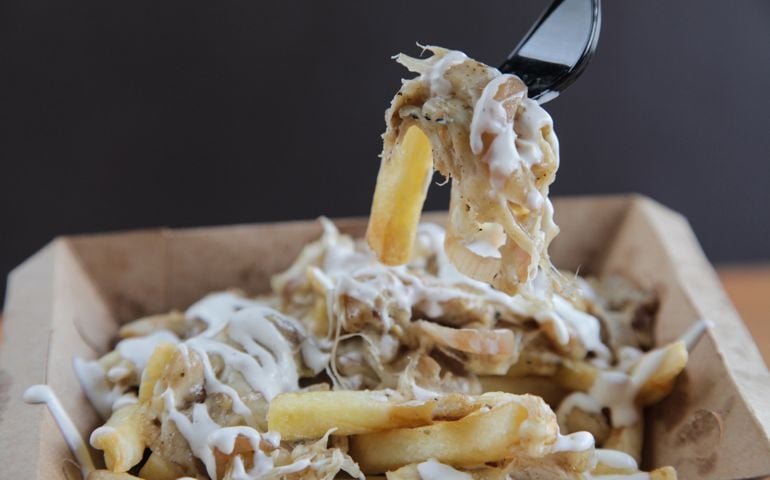Poutine fries with meat and cheese