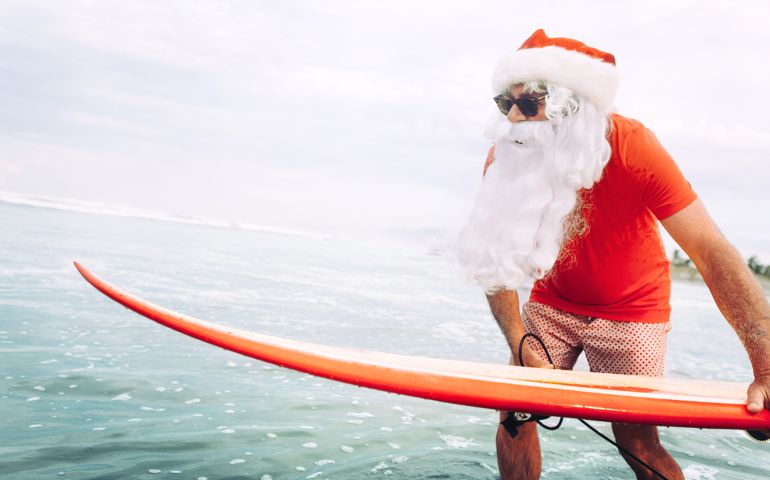 Santa Claus with surf board