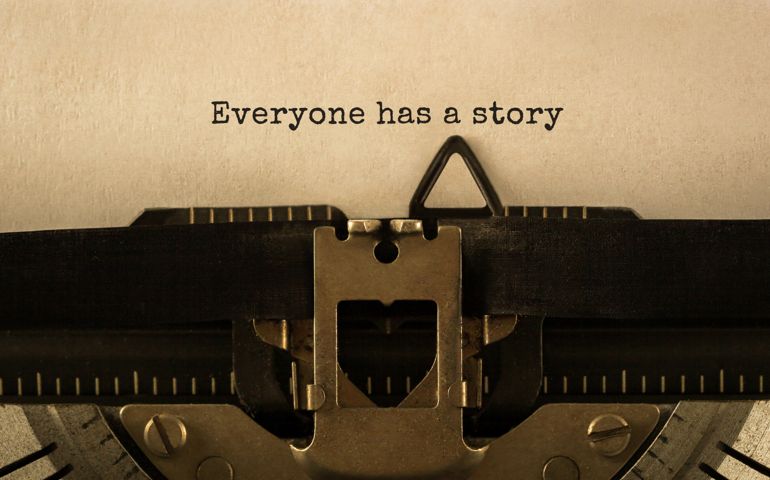 Text Everyone has a story typed on retro typewriter