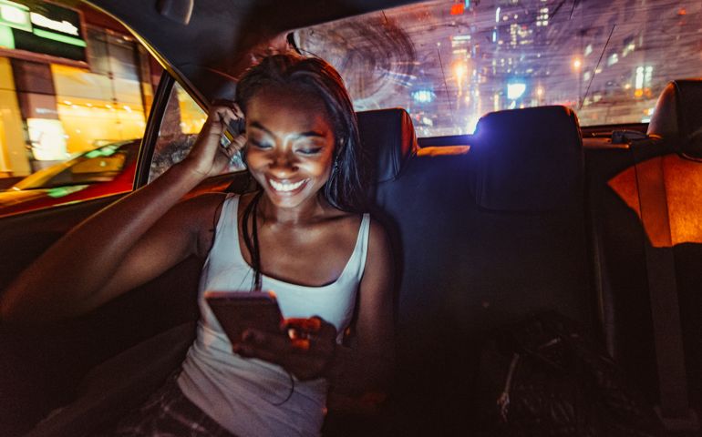 African American Woman Commuting by Taxi in New York City.