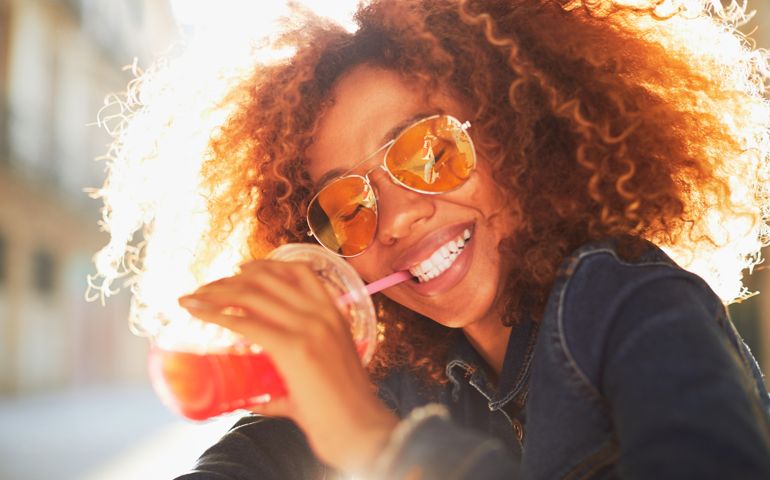 Beautiful young woman with afro hair in summer themes. Made in Barcelona with model from Venezuela.