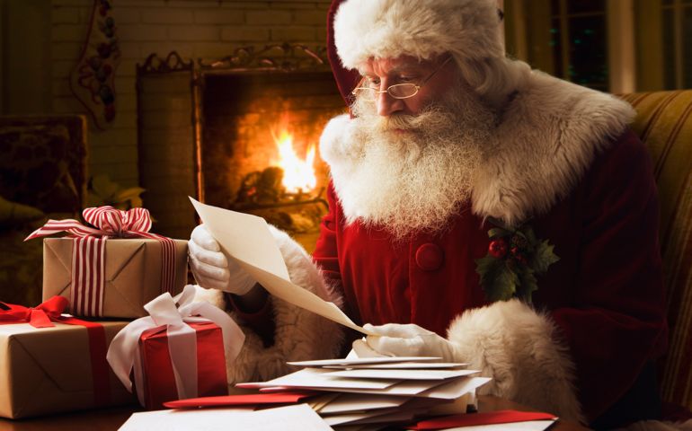 Santa Claus reading letter, close-up