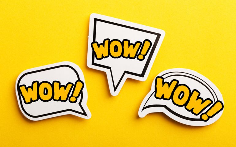 WOW concept speech bubble isolated on yellow background.