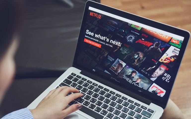 Netflix app on Laptop screen.