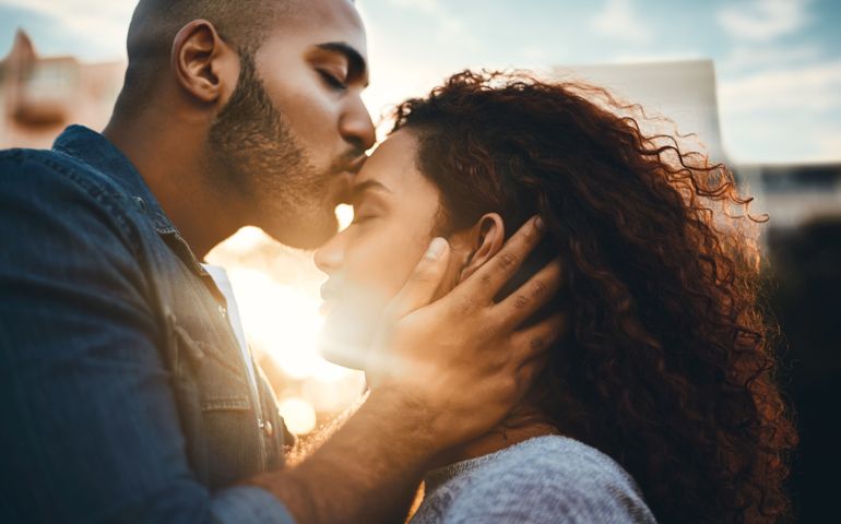 Shot of an affectionate young couple bonding together outdoors