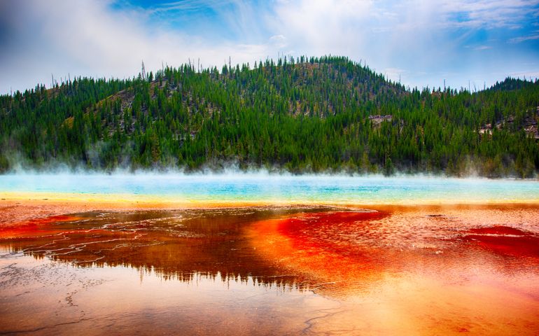 Located in Yellowstone National Park, Wyoming, the largest hot spring in the United States and third larges in the world. The amazing colors are actually the heat loving microbes in the pools.