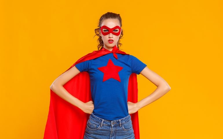 concept. a woman in a superhero costume on Colored yellow background