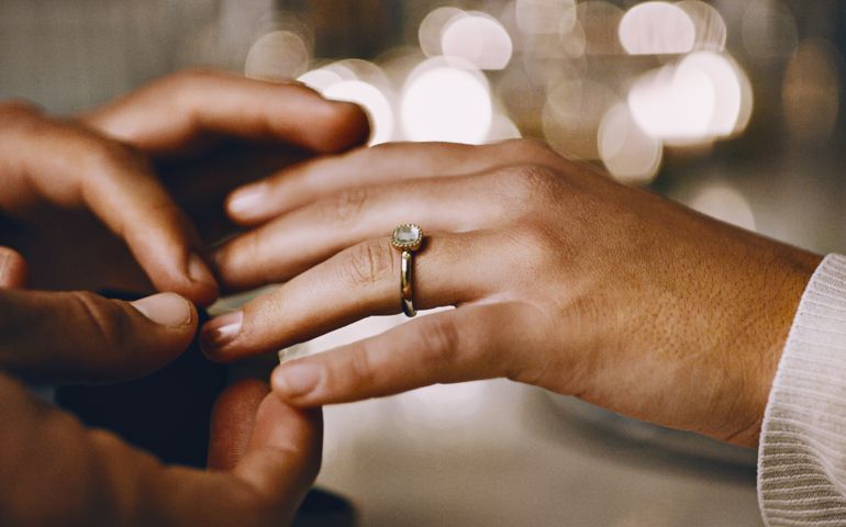 Closeup shot of an unrecognizable man proposing marriage to his girlfriend