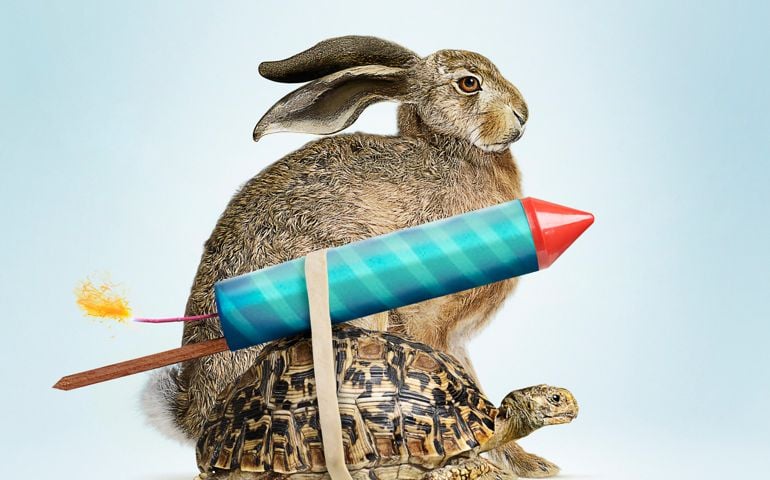 Tortoise and Hare with lit rocket attached to the back of the tortoise to give it an advantage