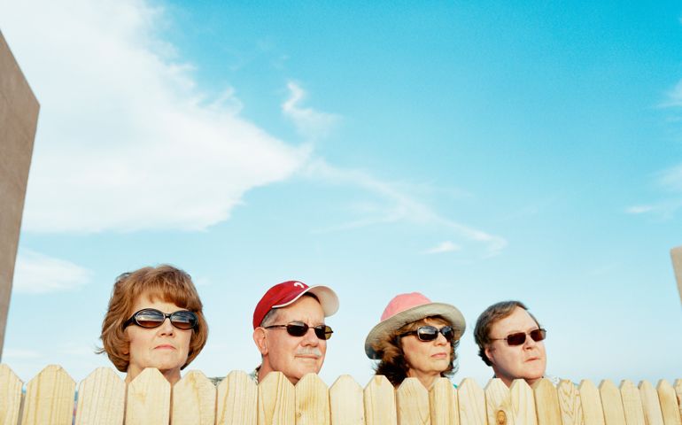 Group of people looking over fence