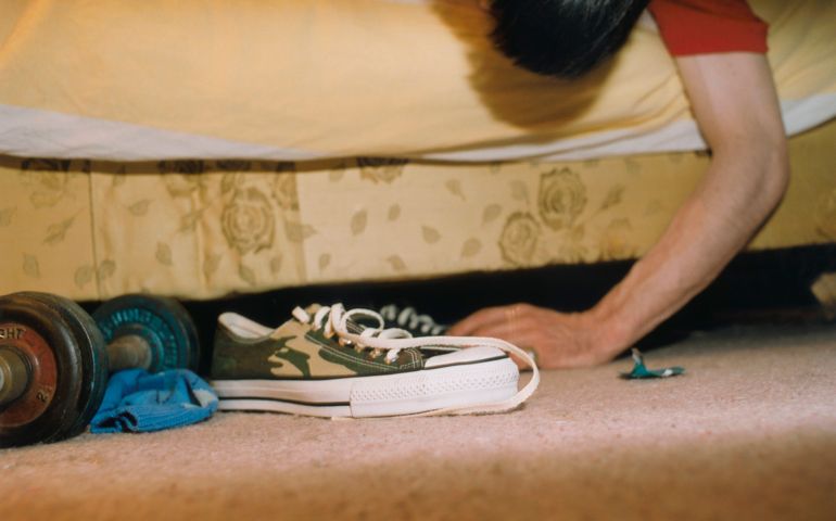 Man Looking Under Bed