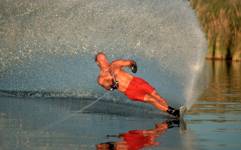 Professional water skier Mike Mack does a slalom turn on the Colorado River.
