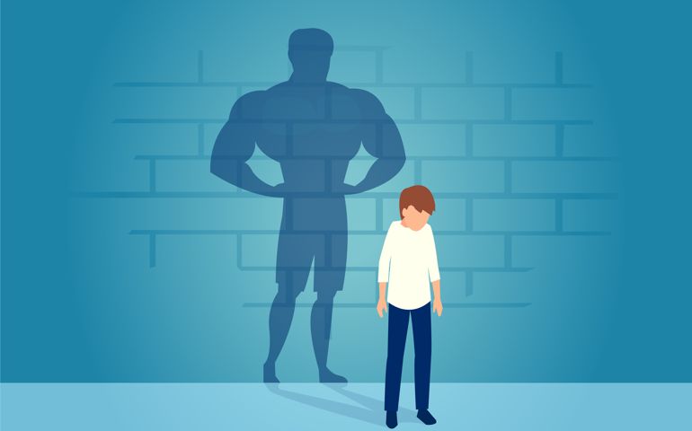 Vector of a sad weak man teenager standing depressed in front of a wall with his strong shadow of himself