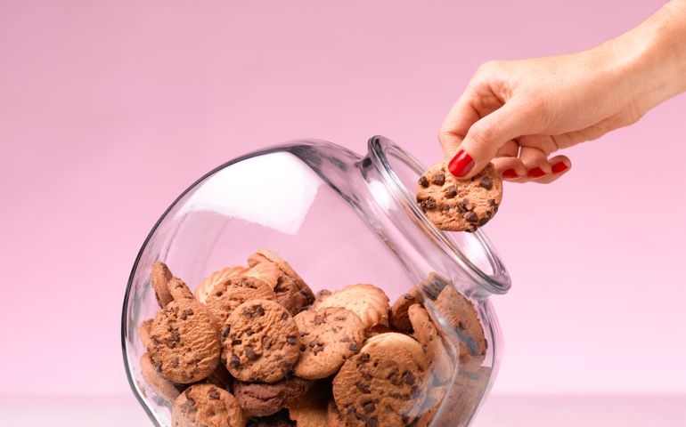 Temptation - hand in a cookie jar