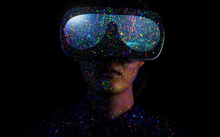 Woman on Color ink illuminating with black light,Using a virtual reality headset
