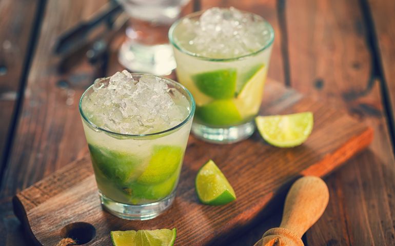 Sweet and refreshing Caipirinha national cocktail from Brazil made with lime,ice, sugar, and a sugarcane liquor
