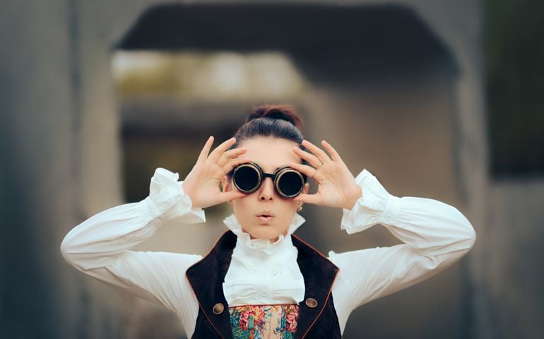 Girl in Victorian fashion style costume wearing goggles