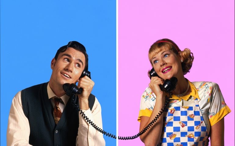 Couple with wistful expressions, using telephones (Composite)
