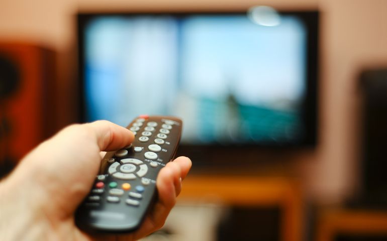 Watching TV and using remote controller