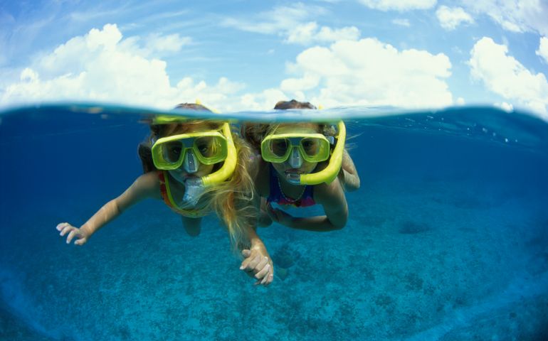 TWO YOUNG GIRLS SNORKELING (CAYMAN)