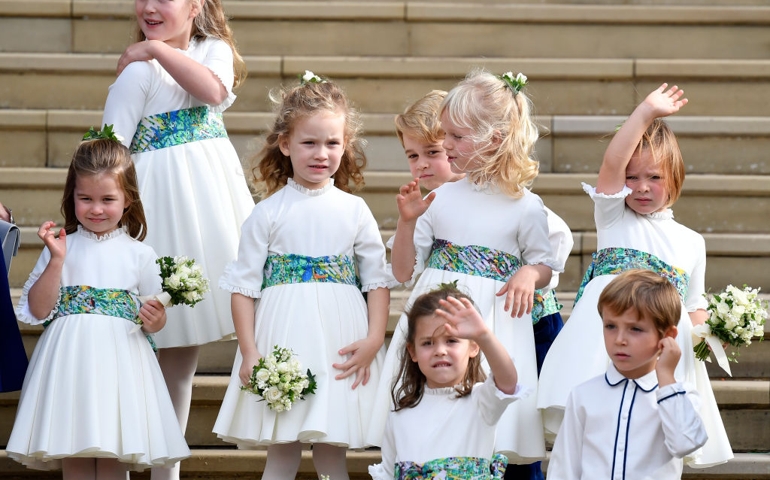Bridesmaids Princess Charlotte of Cambridge, Savannah Phillips, Maud Windsor, page boy Prince George of Cambridge, bridesmaids Isla Phillips, Theodora Williams, Mia Tindall and page boy Louis de Givenchy wave as they leave after the royal wedding of Princess Eugenie of York to Jack Brooksbank at St. George's Chapel on October 12, 2018 in Windsor, England.