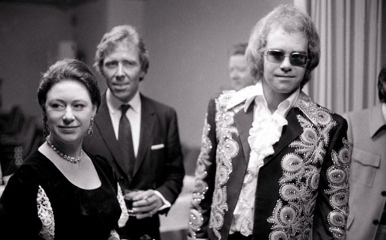 Princess Margaret and Lord Snowdon meet singer Elton John backstage at a benefit concert held at the Shaw Theatre in London, England on February 27, 1972.