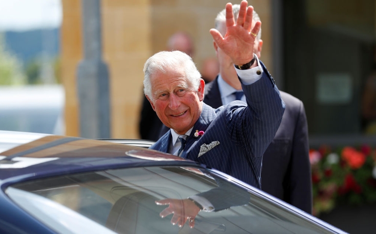 Prince Charles, Prince of Wales waves as he leaves the GCHQ headquarters on July 12, 2019 in Cheltenham, England. The visit is part of the Agency's Centenary celebrations.