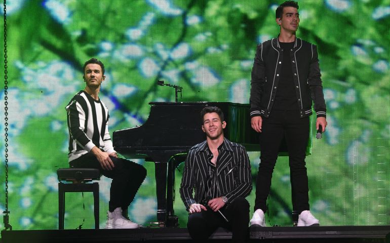 NEW YORK, NEW YORK - AUGUST 30: (L-R) Kevin Jonas, Nick Jonas and Joe Jonas perform onstage during Jonas Brothers: "Happiness Begins" Tour at Madison Square Garden on August 30, 2019 in New York City.