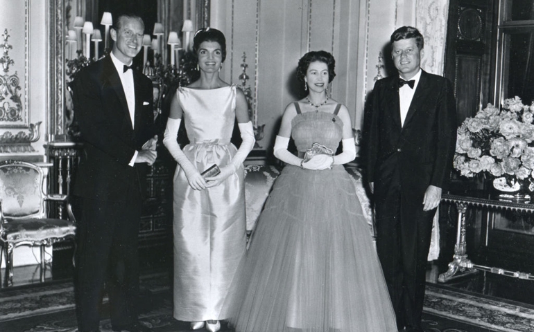 At Buckingham Palace during a banquest held in his honor, American President John F. Kennedy (1917 - 1963) (right) and his wife, First Lady Jacqueline Kennedy (1929 - 1994) (second left), pose with Queen Elizabeth II of Great Britain (second right) and her husband, Prince Philip, Duke of Edinburgh, London, United Kingdom, June 15, 1961. Mrs. Kennedy's dress was designed by Chez Ninon while the Queen wore a Hartnell gown.