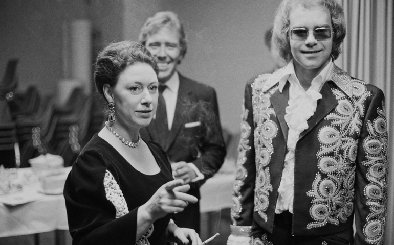 English singer-songwriter Elton John (right) with Princess Margaret (1930 - 2002) and her husband Lord Snowdon, backstage at a benefit concert held at the Shaw Theatre, London, 27th February 1972.