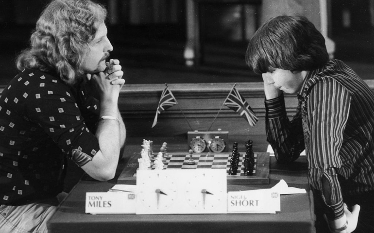 10th April 1980: Tony Miles (left) plays 14-year-old Nigel Short in the opening match of the Phillips and Drew Chess Tournament a