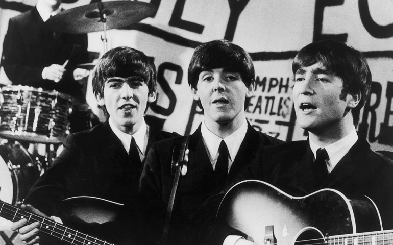Top British pop group The Beatles in performance, from left to right; Ringo Starr, George Harrison (1943 - 2001), Paul McCartney and John Lennon (1940 - 1980).