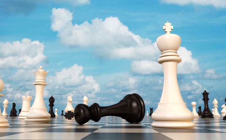 Chess board, black king lying beside white king