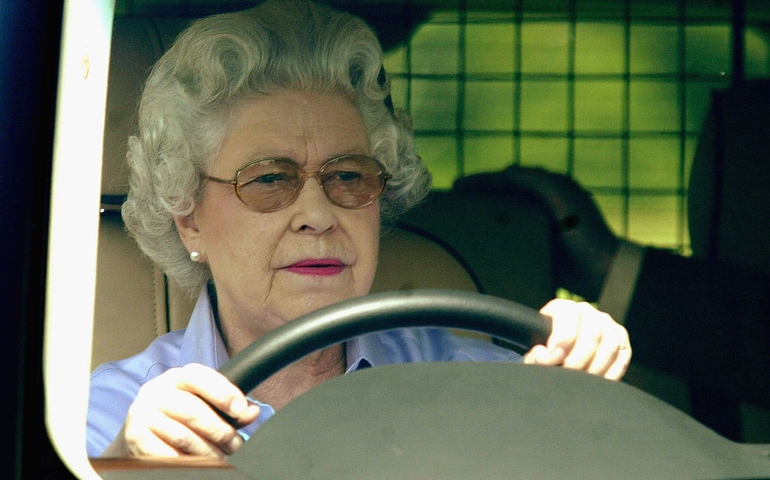Queen Elizabeth drives around the grounds of Windsor as she attends the third day of the Royal Windsor Horse Show at Home Park on May 15, 2004 in Windsor, England.
