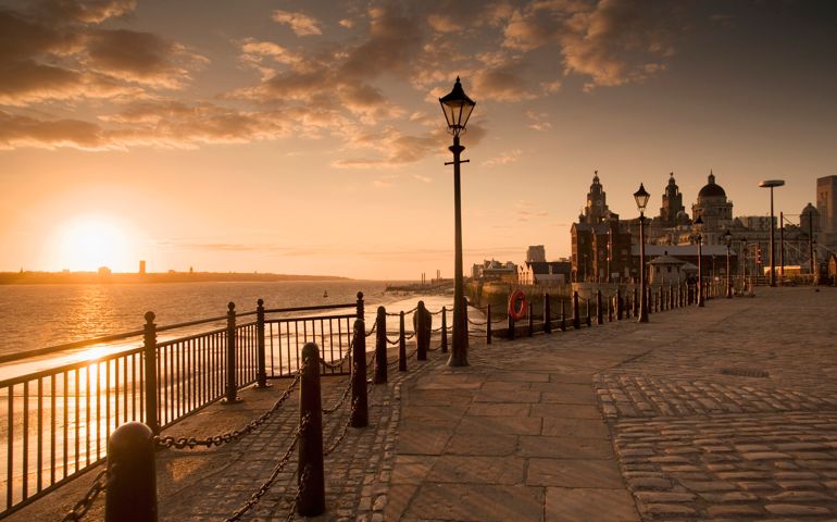 Albert Dock and the Three Graces (Royal Liver Building, Cunard Building, Port of Liverpool Building)at sunset.