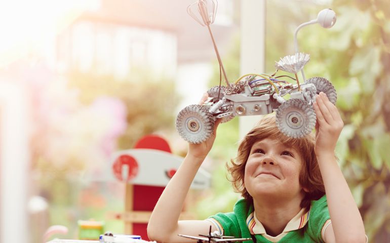 Portrait of child being creative and making things