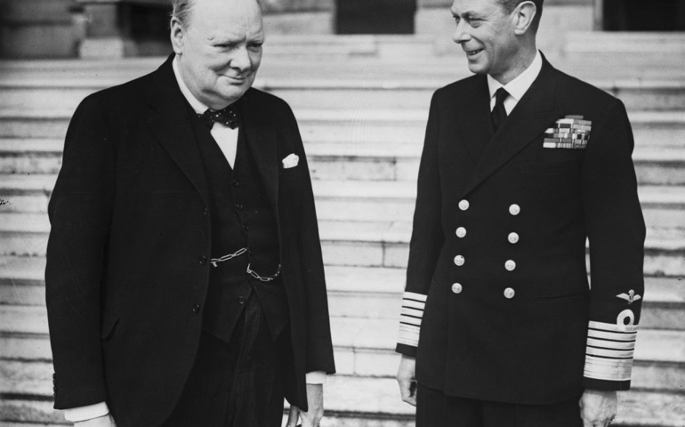 British Prime Minister Winston Churchill (1874 - 1965) with King George VI (right) in the grounds of Buckingham Palace, London, during World War II, circa 1942. (