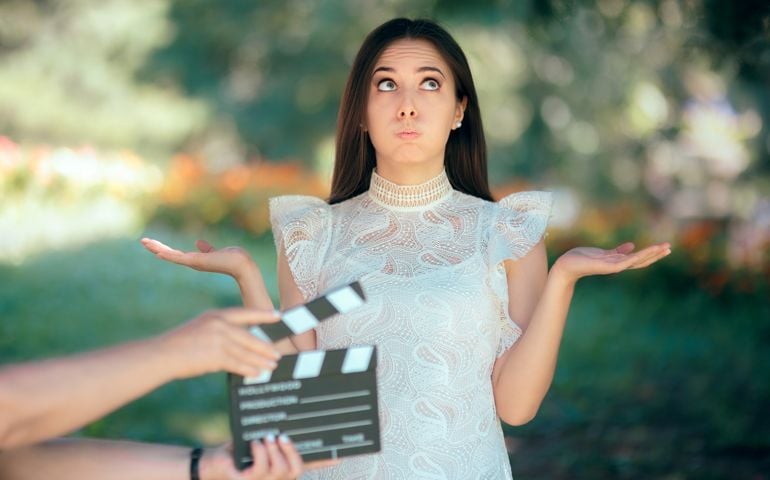 Woman reading her part on a microphone for a role