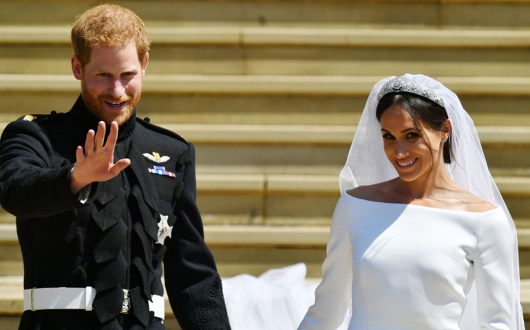 Prince Harry and Meghan Markle leave St George's Chapel through the west door after their wedding in St George's Chapel at Windsor Castle on May 19, 2018 in Windsor, England.