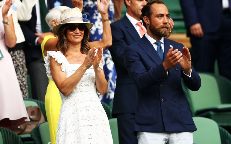 Pippa Middleton and James Middleton applaud Kyle Edmund of Great Britain defeating Bradley Klahn of the United States during in the Men's Singles second round match on day four of the Wimbledon Lawn Tennis Championships at All England Lawn Tennis and Croquet Club on July 5, 2018 in London, England.