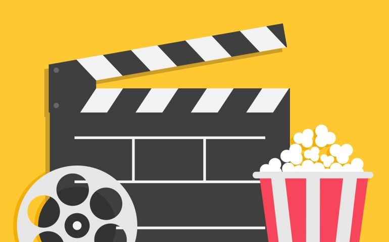 Big open clapper board Movie reel Popcorn Cinema