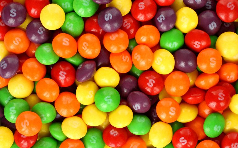 Skittles multicolored fruit candies background