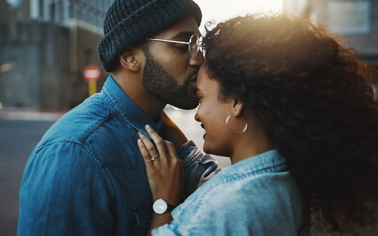 Shot of a young couple sharing a romantic moment in the city