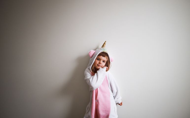 pretty girl wearing pink unicorn kigurumi