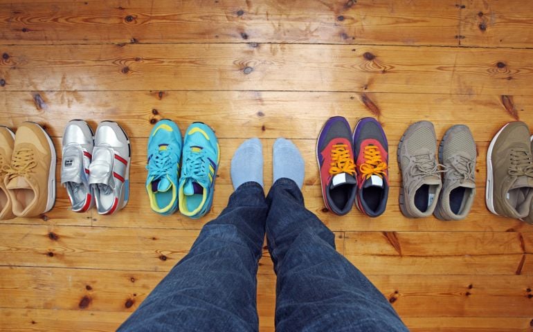 Deciding on what footwear to put on from choice of trainers.