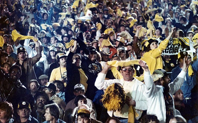PASADENA, CA - JANUARY 20: Fans of the Pittsburgh Steelers celebrate during Super Bowl XIV with the Pittsburgh Steelers and the Los Angeles Rams on January 20, 1980 at the Rose Bowl in Pasadena, California.